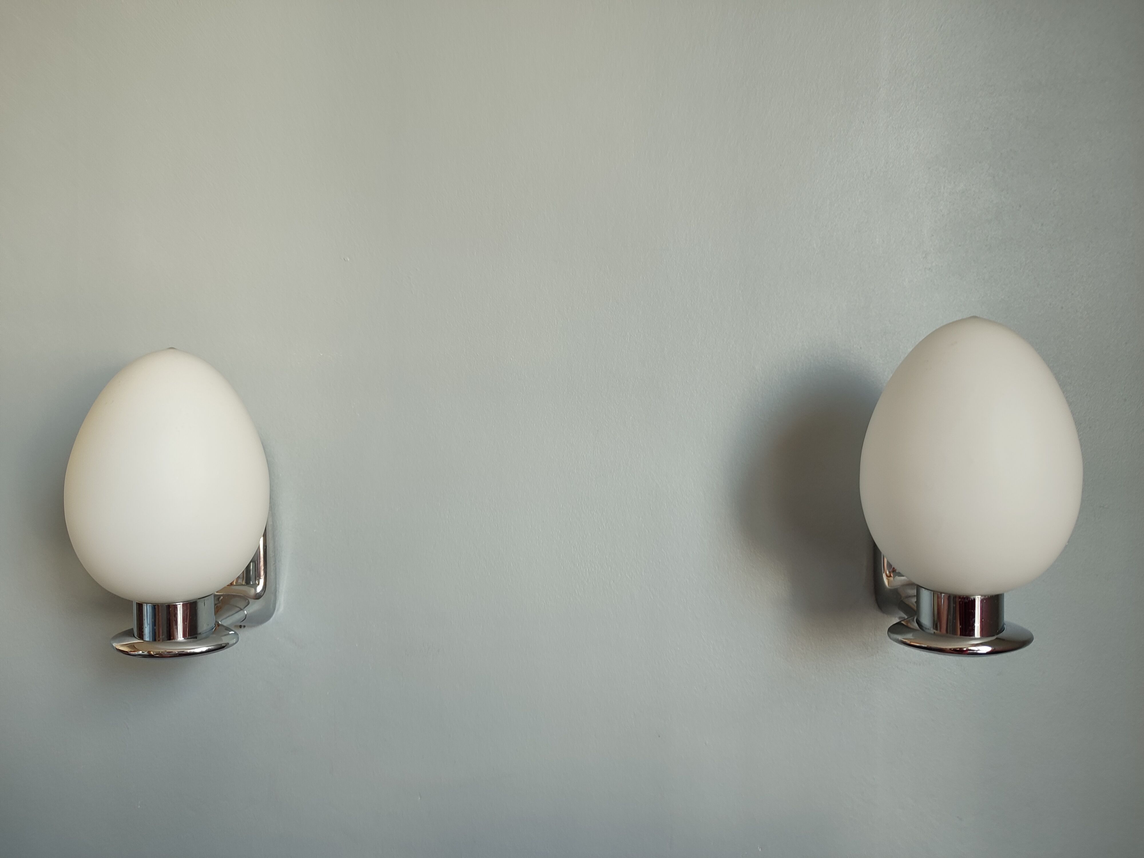 Pair of ouefs sconces in opaline and vintage chromed metal