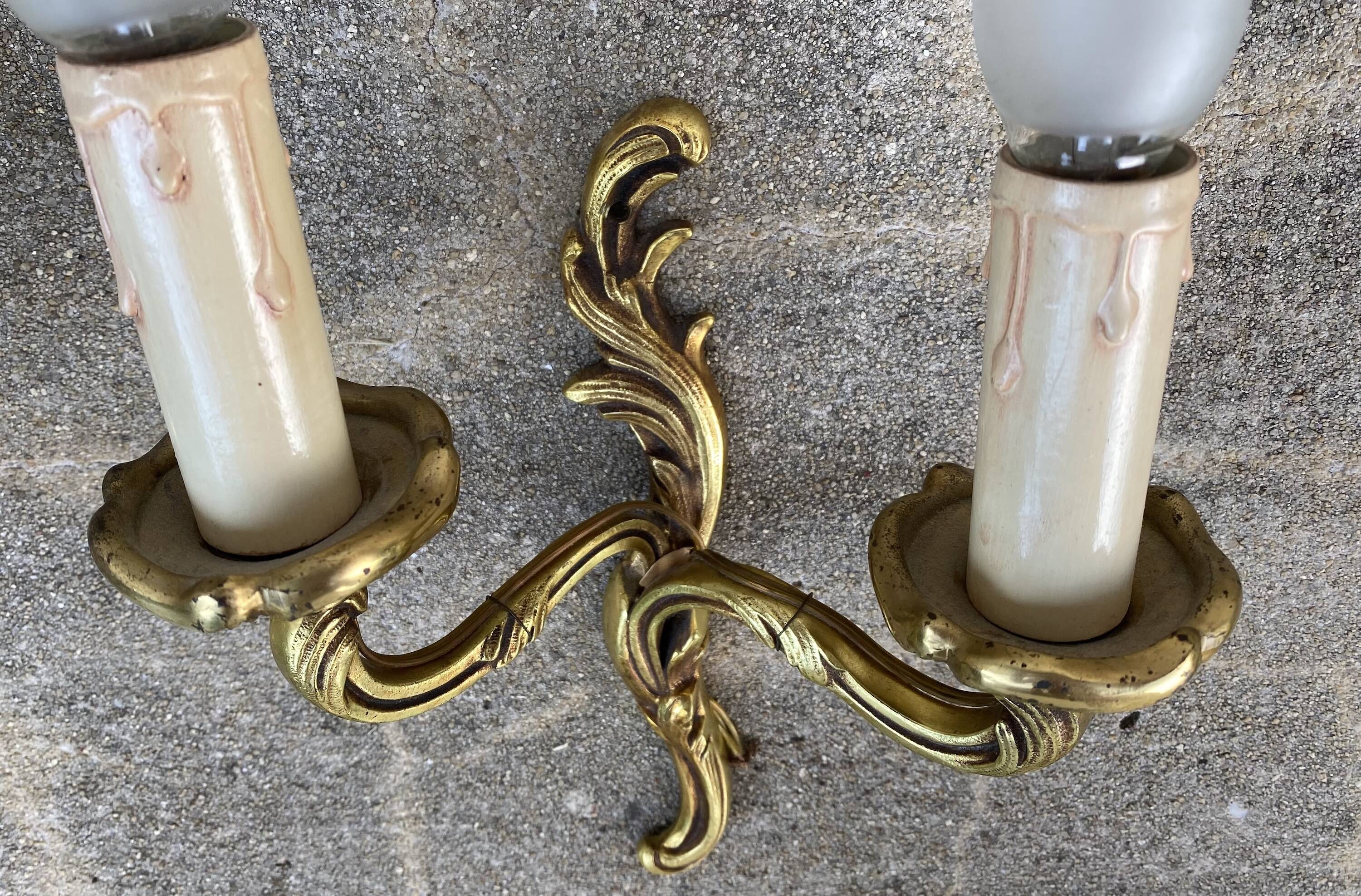 Pair of baroque gilt bronze wall lamps