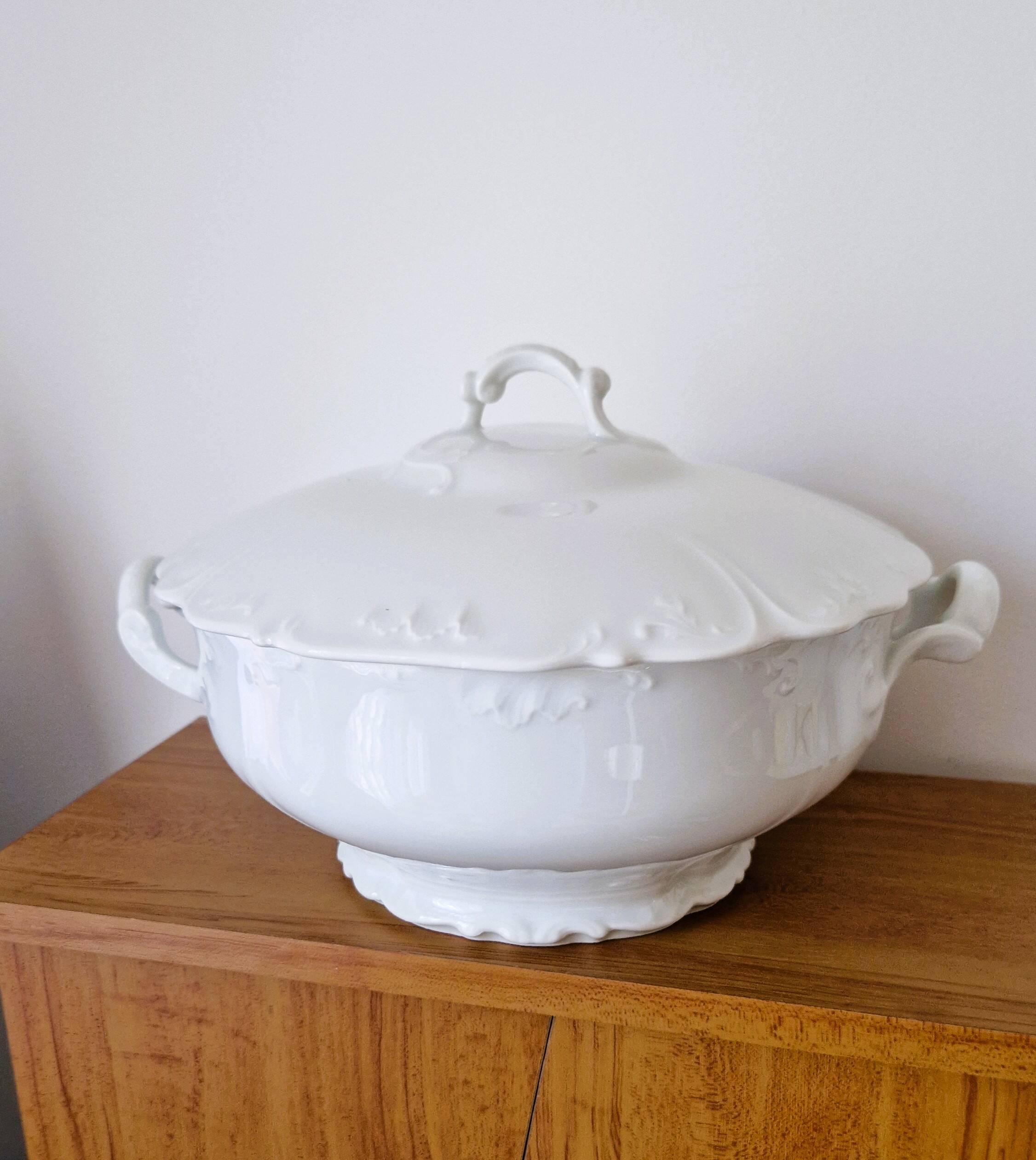 White porcelain soup tureen from Limoges with a vegetal scroll design.