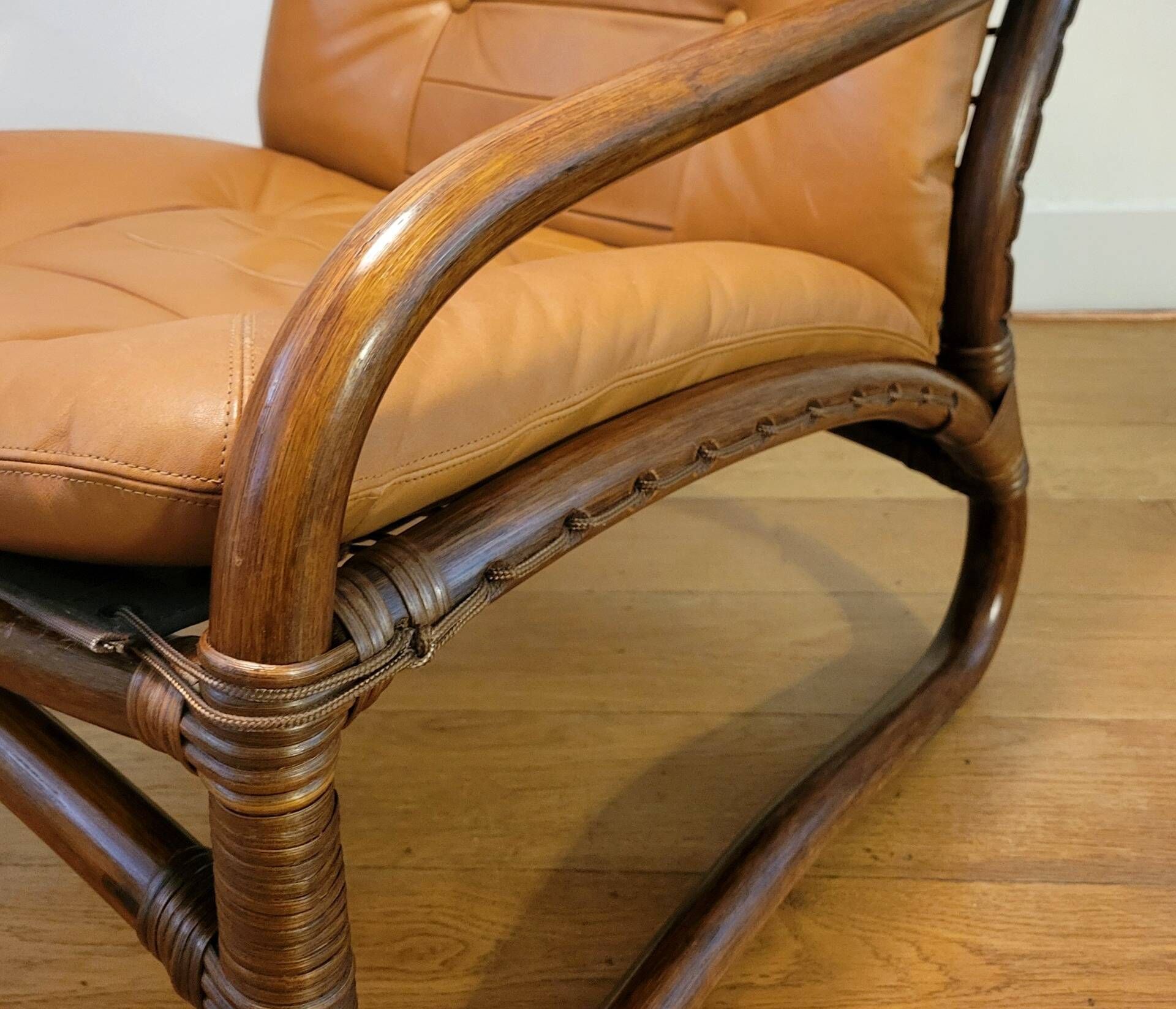 Vintage rattan armchair with leather cushions from 1970