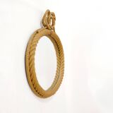 Large oval mirror in rope with pediment, 64cm x 56.5cm.