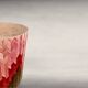 Side table with straw/inlaid concrete.