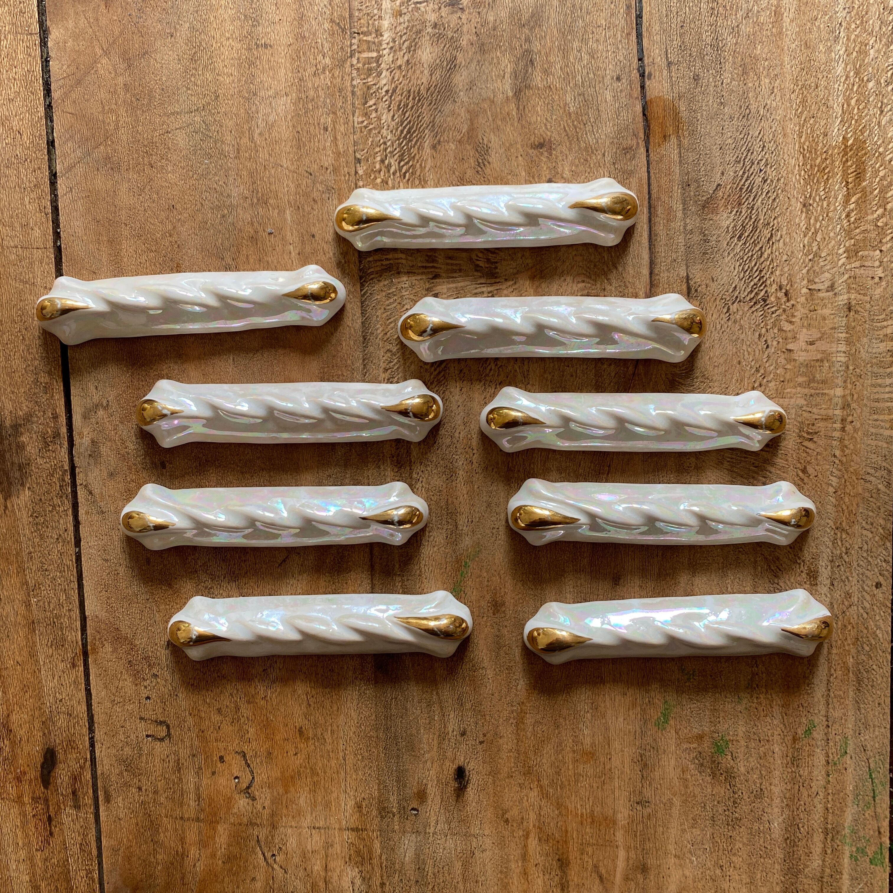 Set of 9 vintage art deco knife holders in pearly and gold ceramic