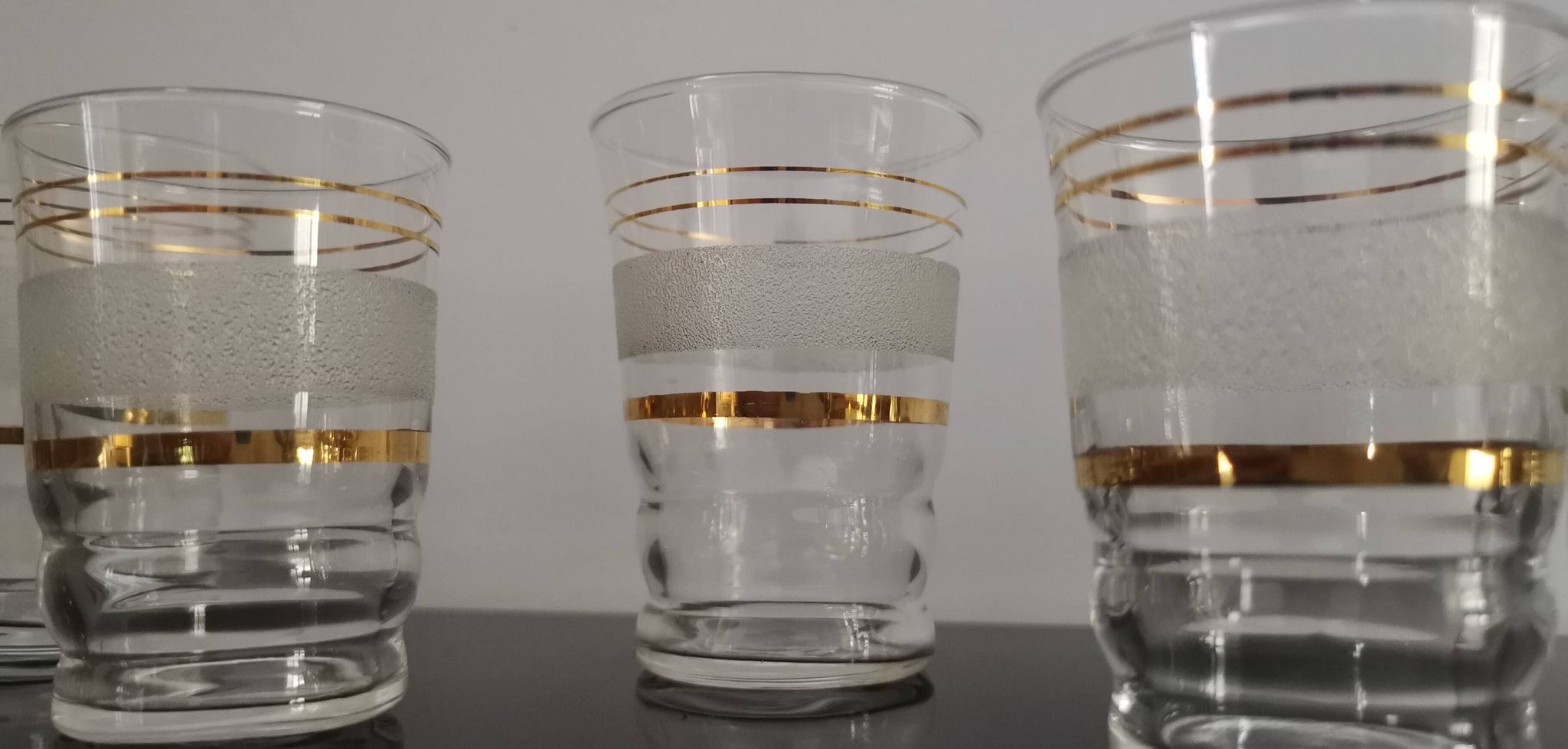 Set of 5 water glasses and 5 aperitif glasses with granite decorations and gold edging from the 1950s