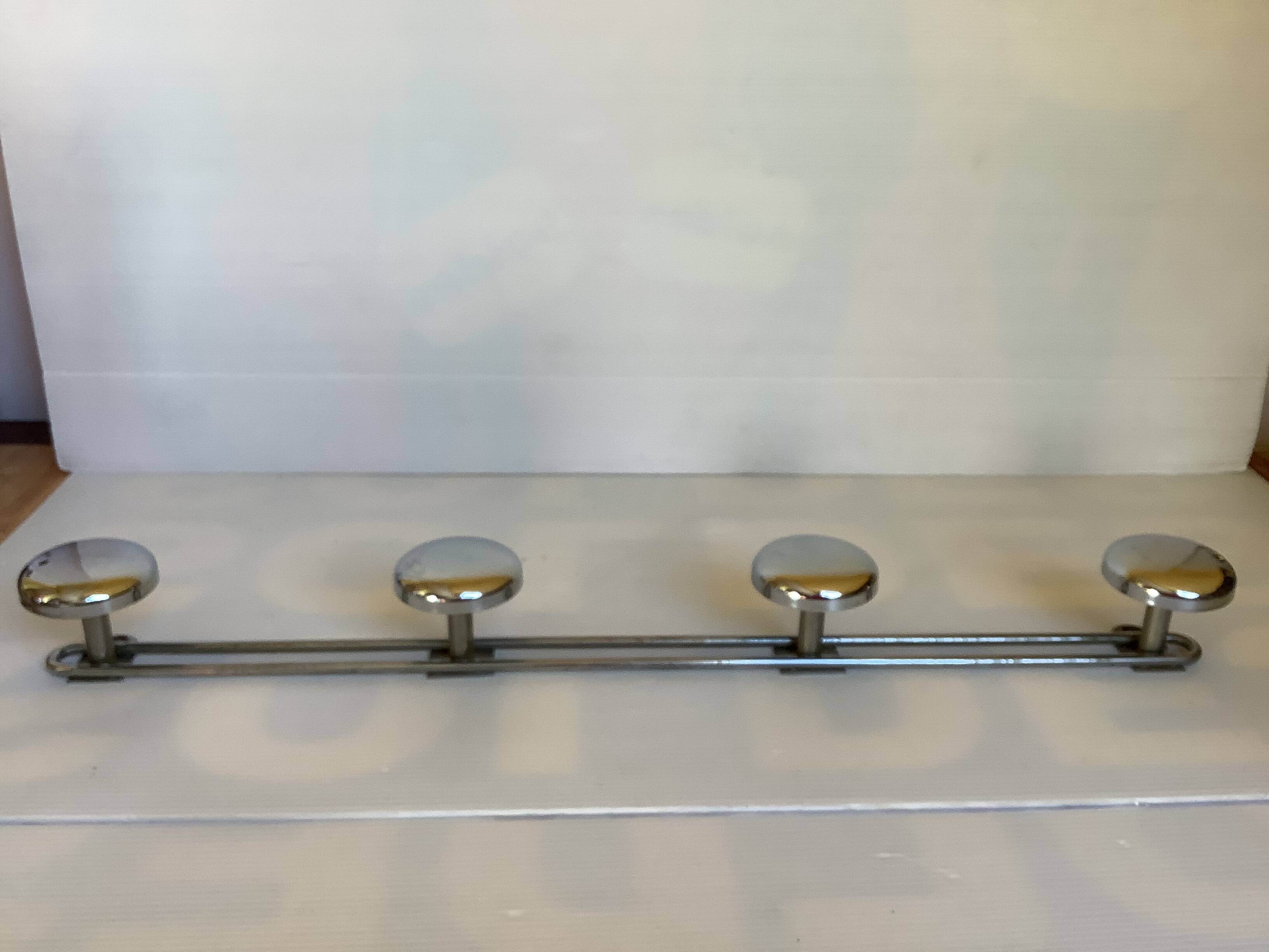 Chromed metal coat rack with four hooks