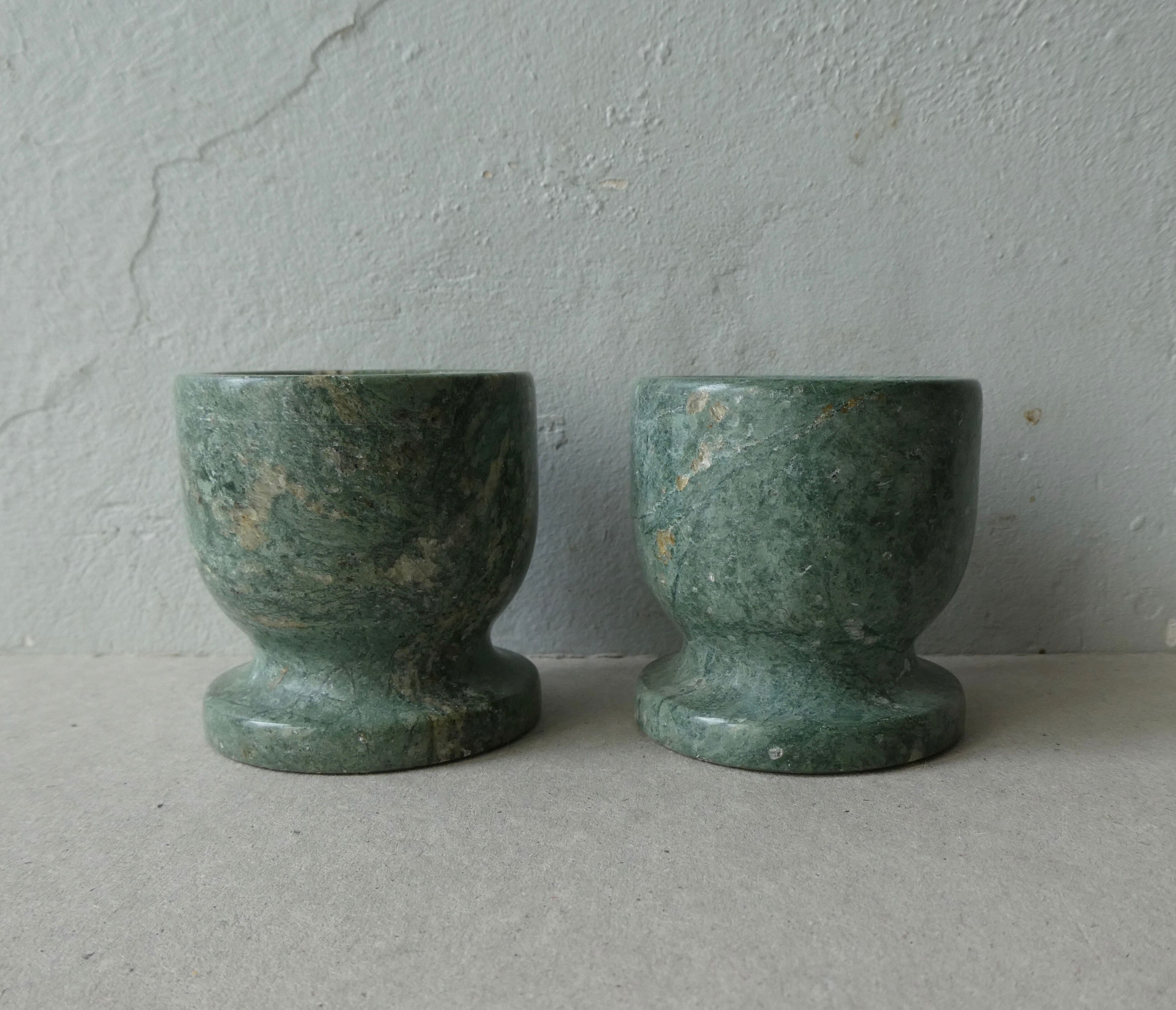 Pair of green marble cockroaches