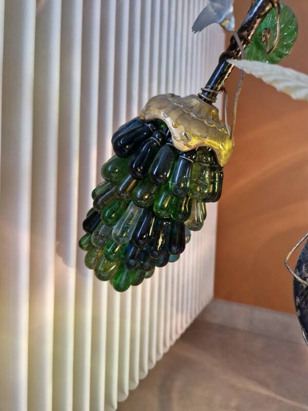 Bronze table lamp and Murano glass grape clusters.