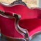 Antique canapé in wood and burgundy velvet in Louis Philippe style.
