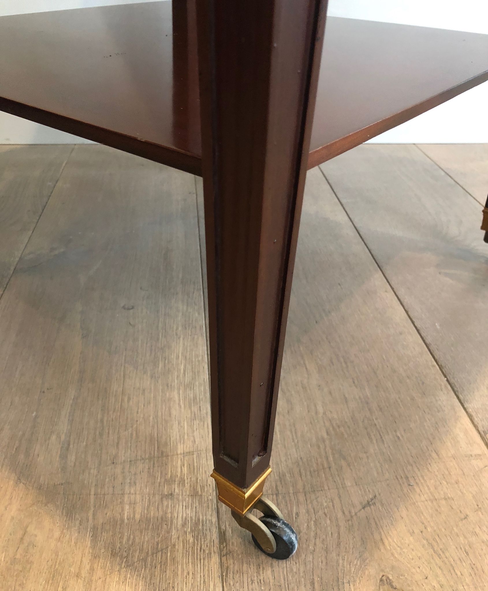 Two-level table in mahogany and brass