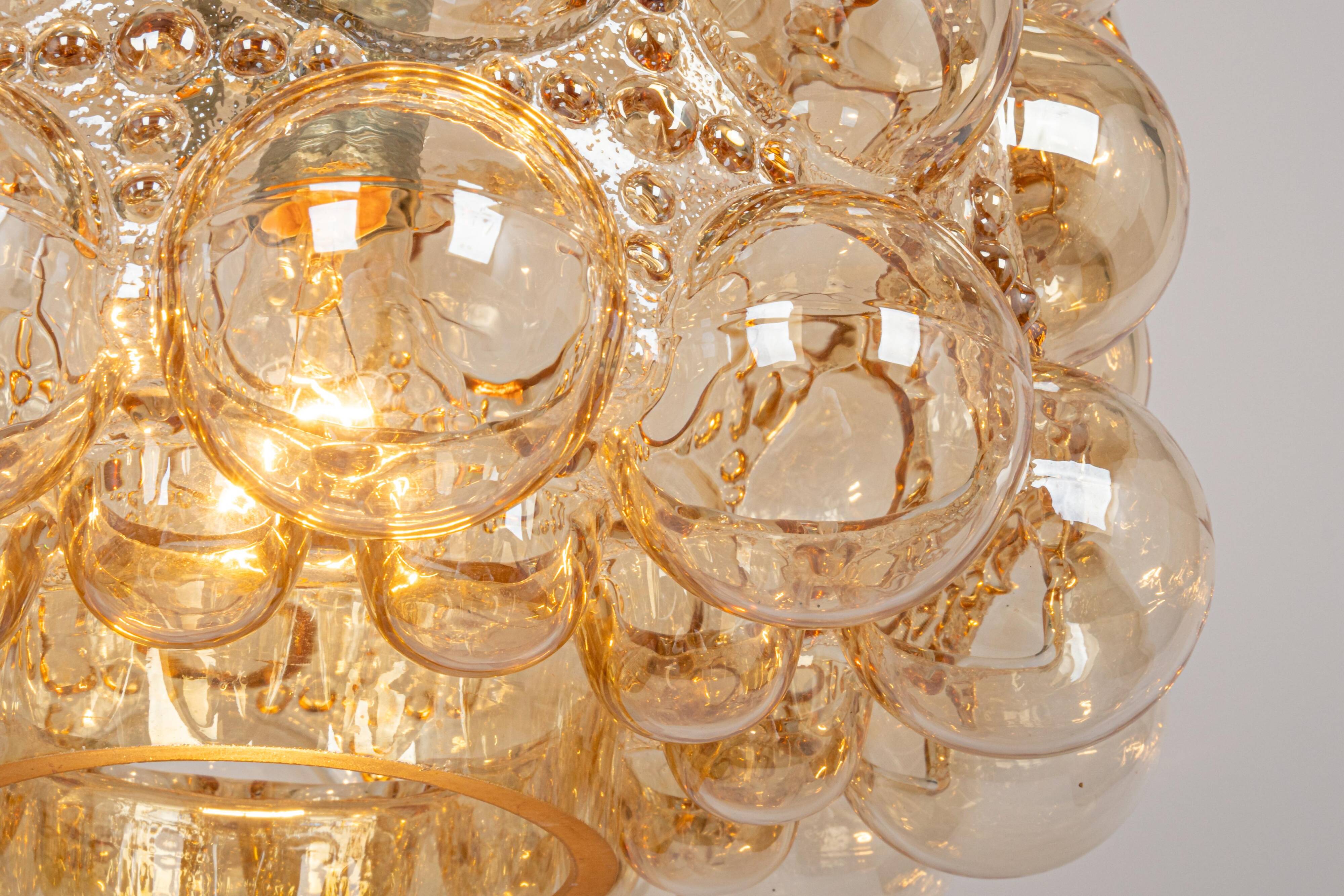 Large amber bubble glass pendant light by Helena Tynell for Limburg, Germany, 1970s.