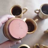 Set of 7 vintage stoneware yellow coffee cups