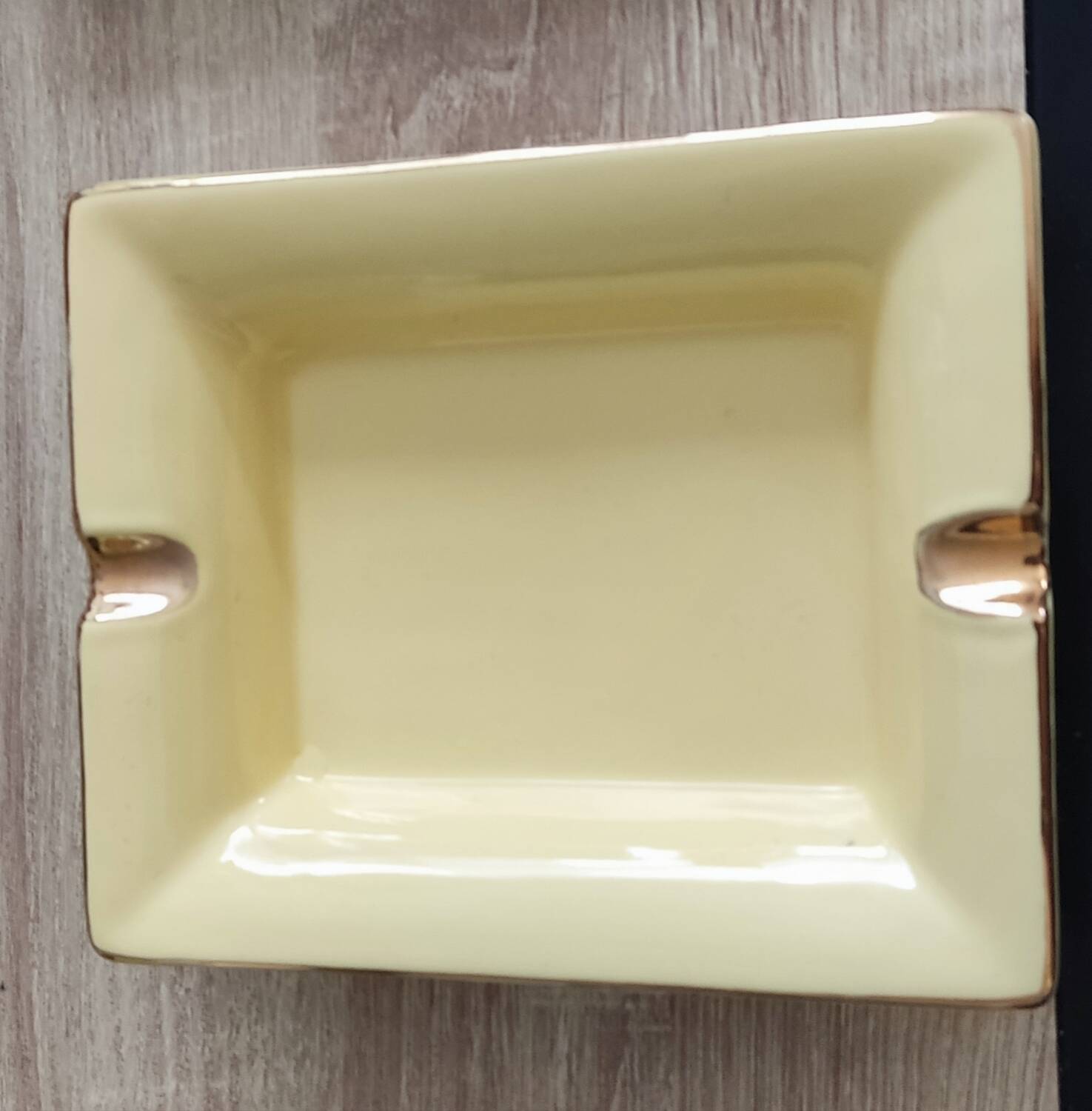 Vintage fine yellow and gold porcelain ashtray.