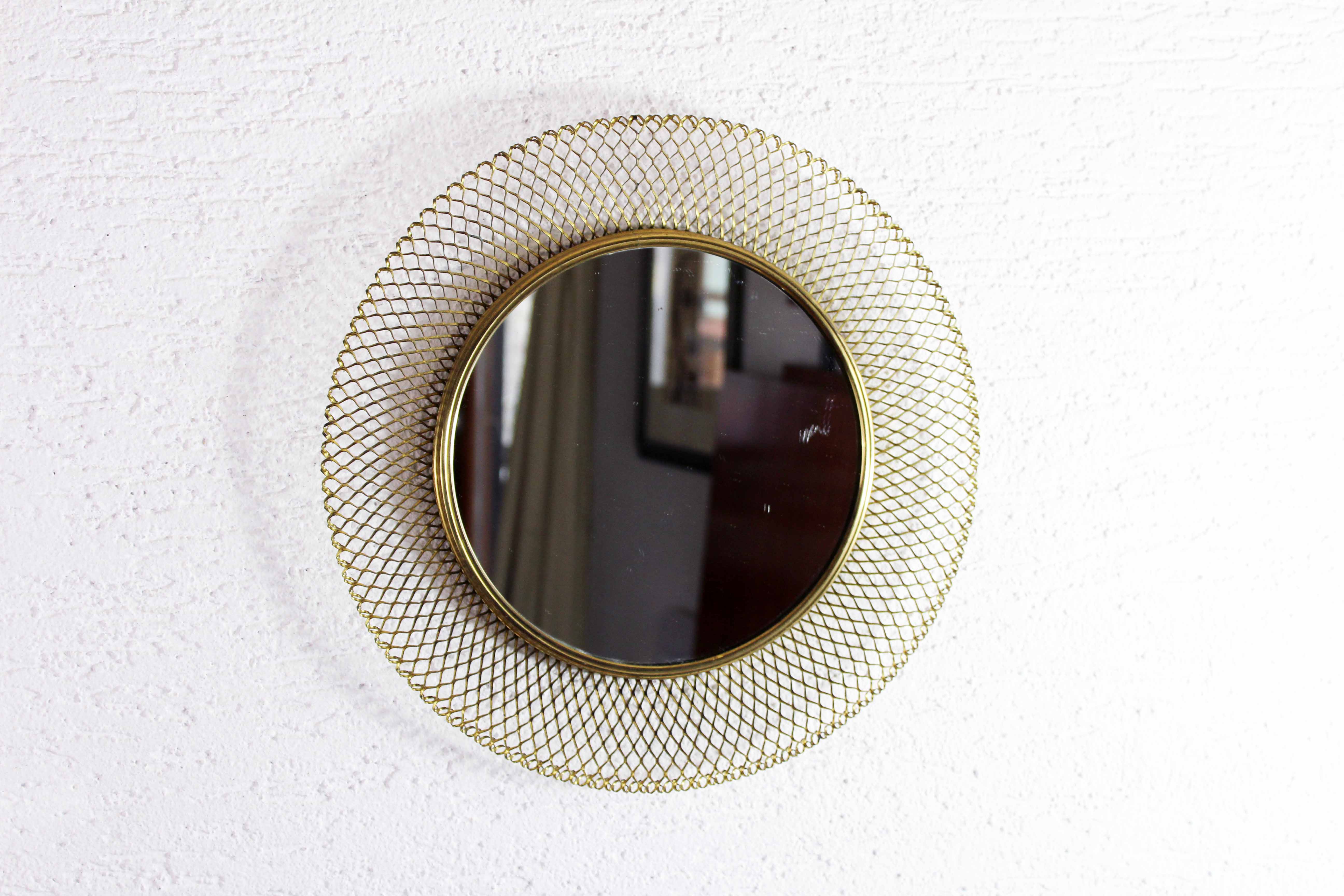 Vintage round mirror in gilded metal