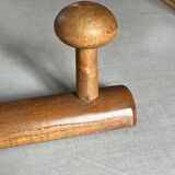 Varnished wooden wall coat rack with 4 hooks, antique item.