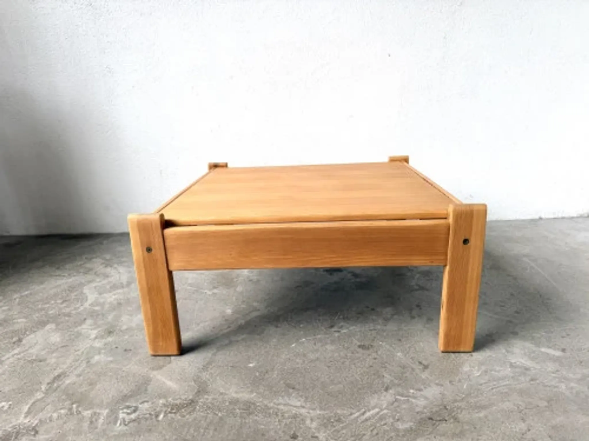 Modernist coffee table in solid pine with a reversible top, 1970s.