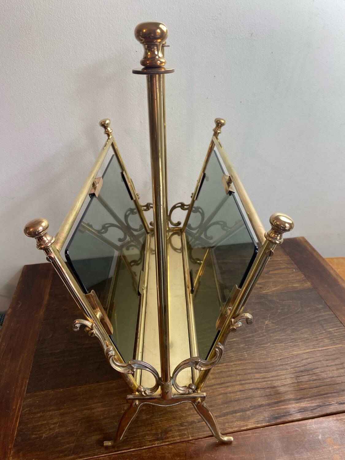 Brass magazine rack and blue-tinted glasses, 1950s.