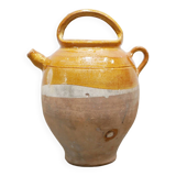 Old gargoulette pot in glazed terracotta