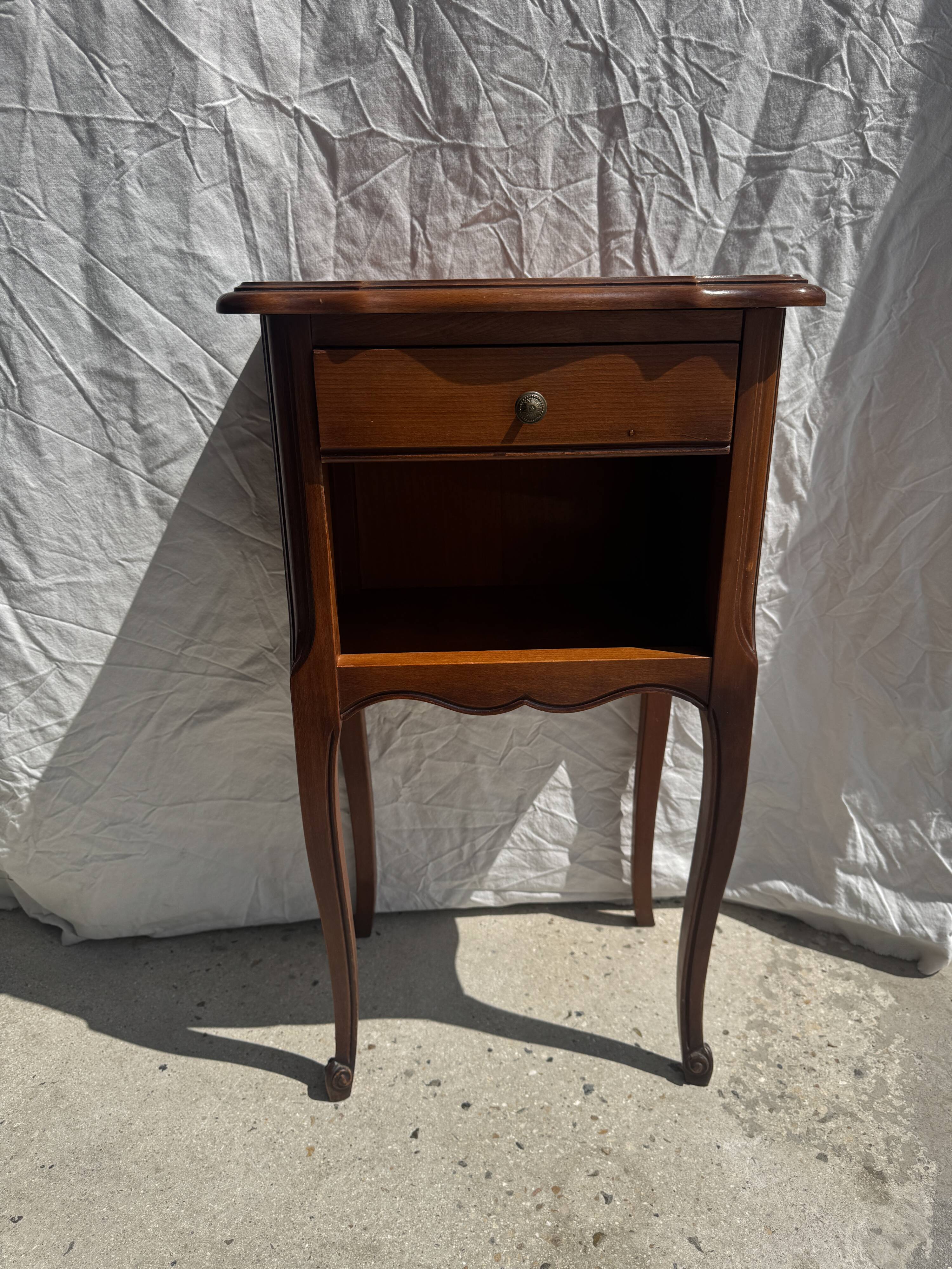 Classic wooden bedside table with drawer