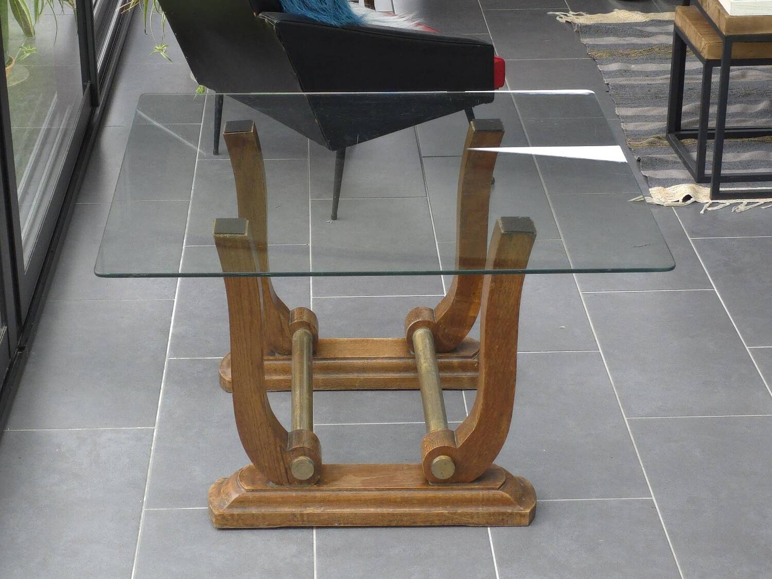 Art Deco coffee table in glass, wood, and brass.