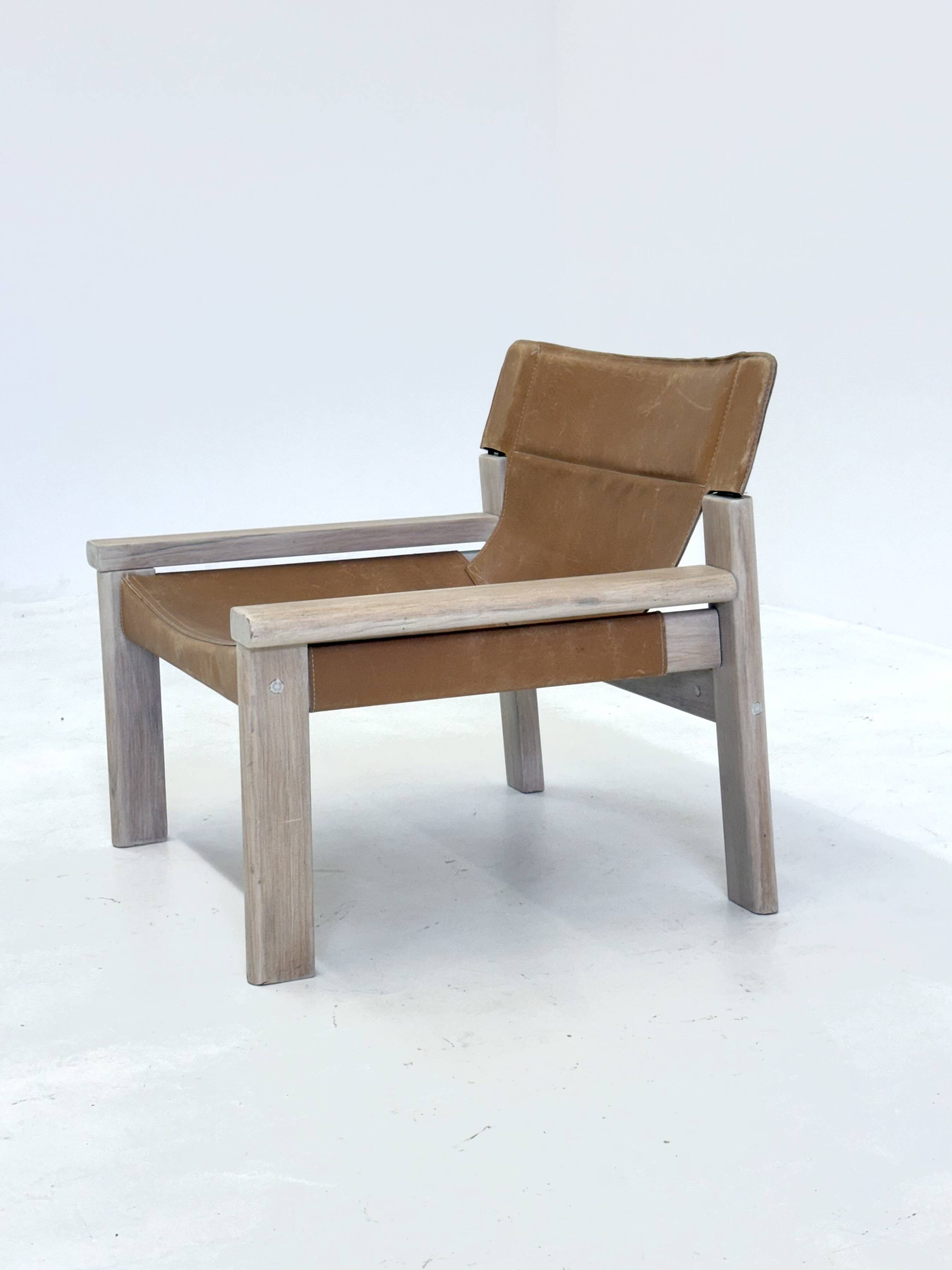 Stylish vintage armchair with saddle leather seat
