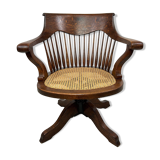 Swivel office chair in oak with a rattan seat.