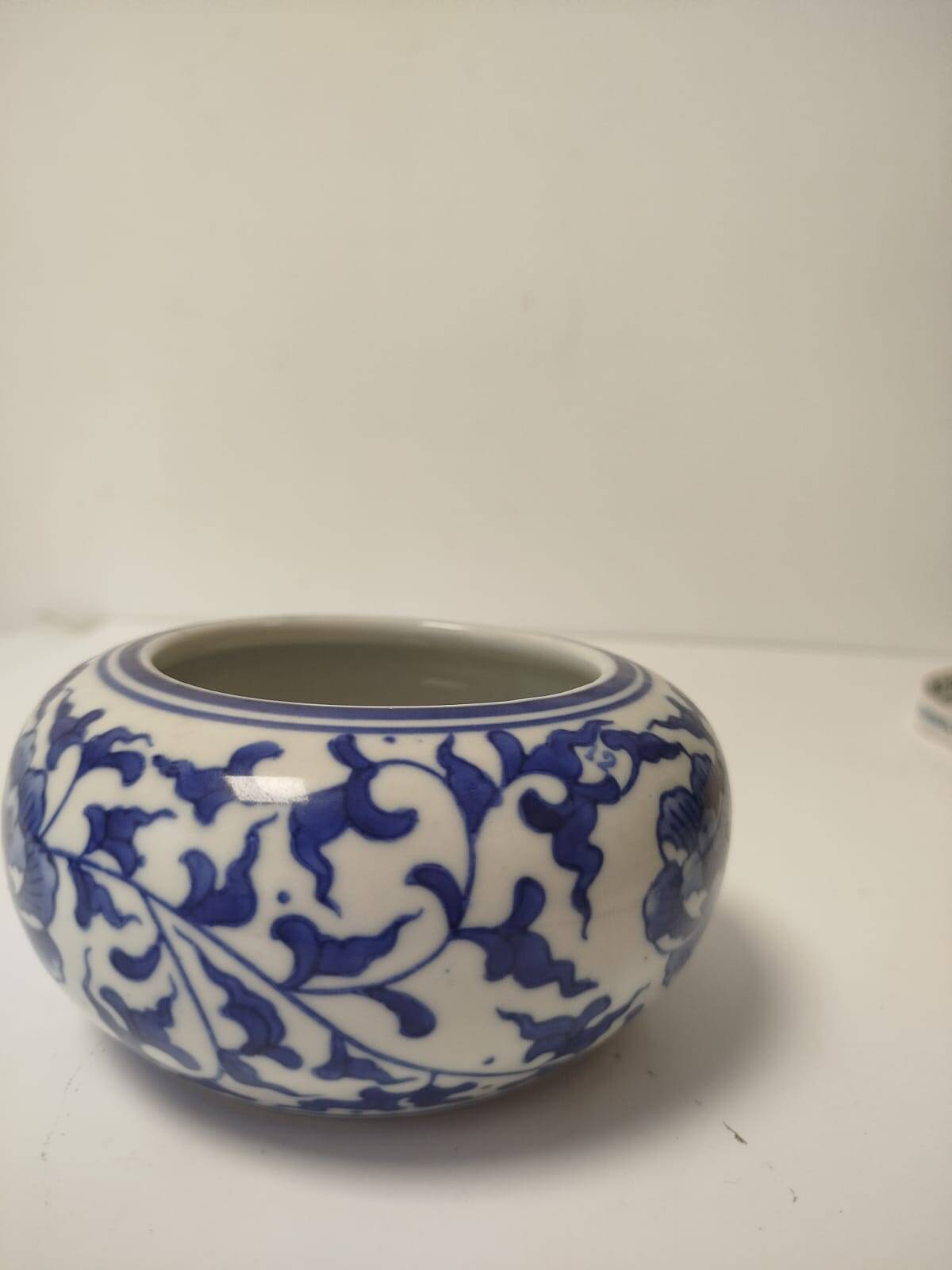 Small round Chinese-style porcelain pot with blue and white decoration