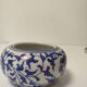 Small round Chinese-style porcelain pot with blue and white decoration