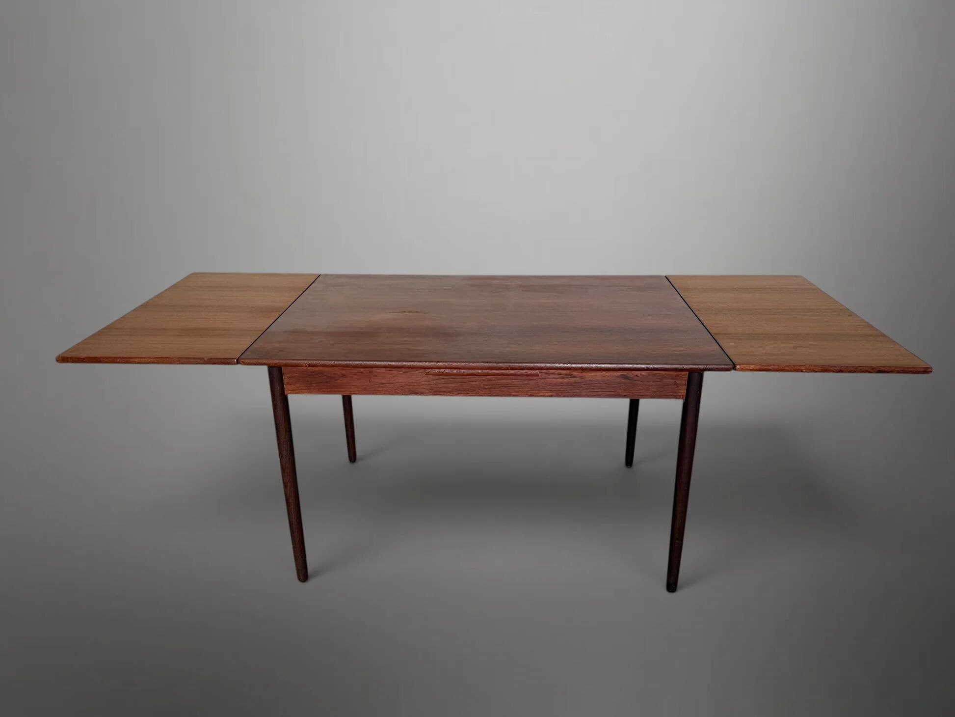 Scandinavian extendable dining table in teak