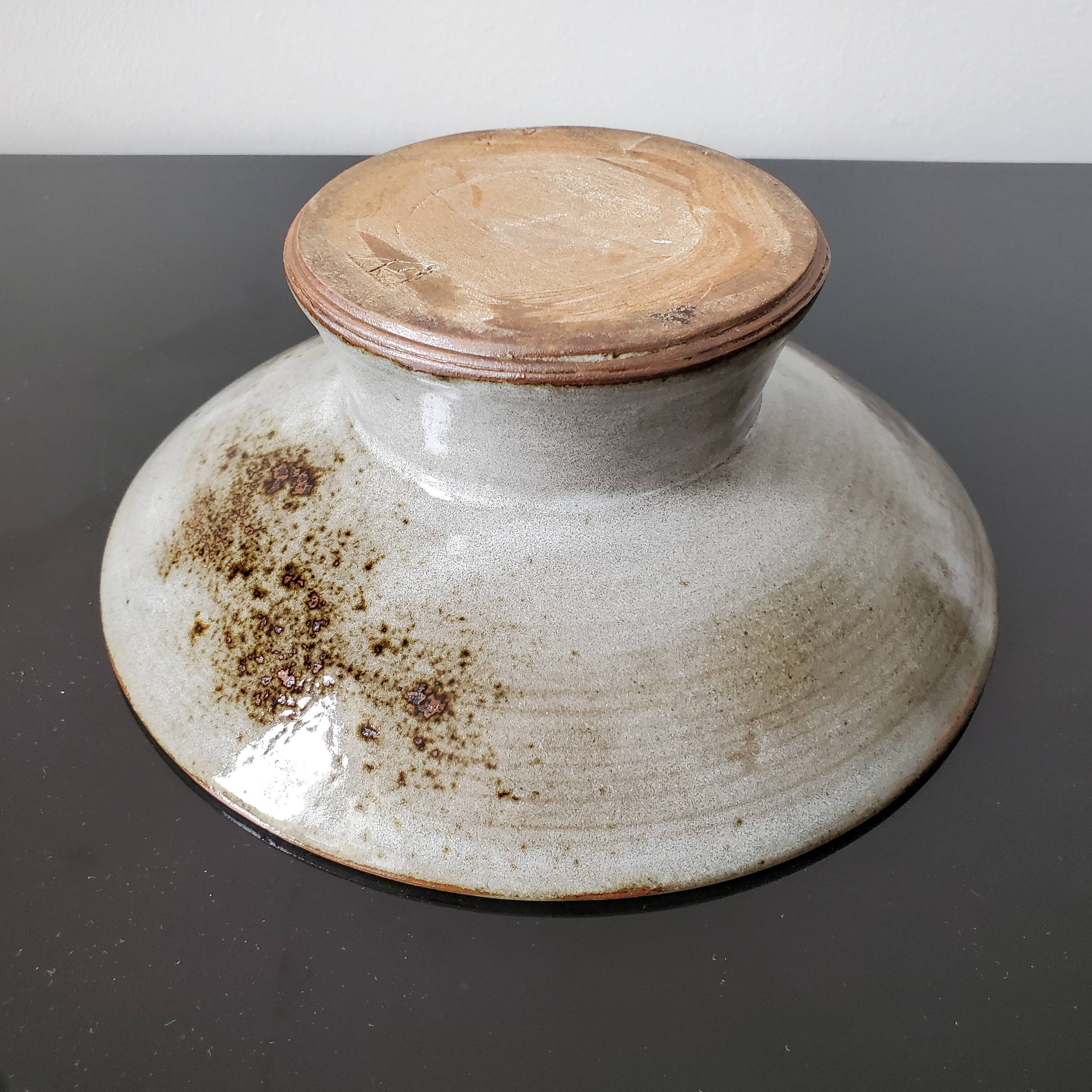 Cup pique flowers in sandstone signed