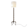 Tripod floor lamp in wrought iron and brass with bamboo-style base.