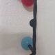 Vintage wall coat rack "Atomic" in wrought iron with multicoloured balls.