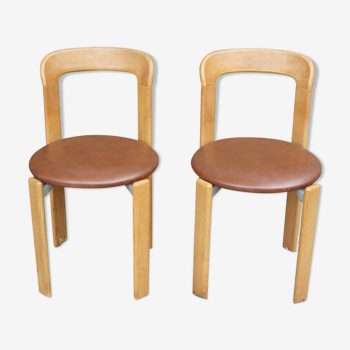 Pair of chairs by Swiss designer Bruno Rey in wood and brown skai