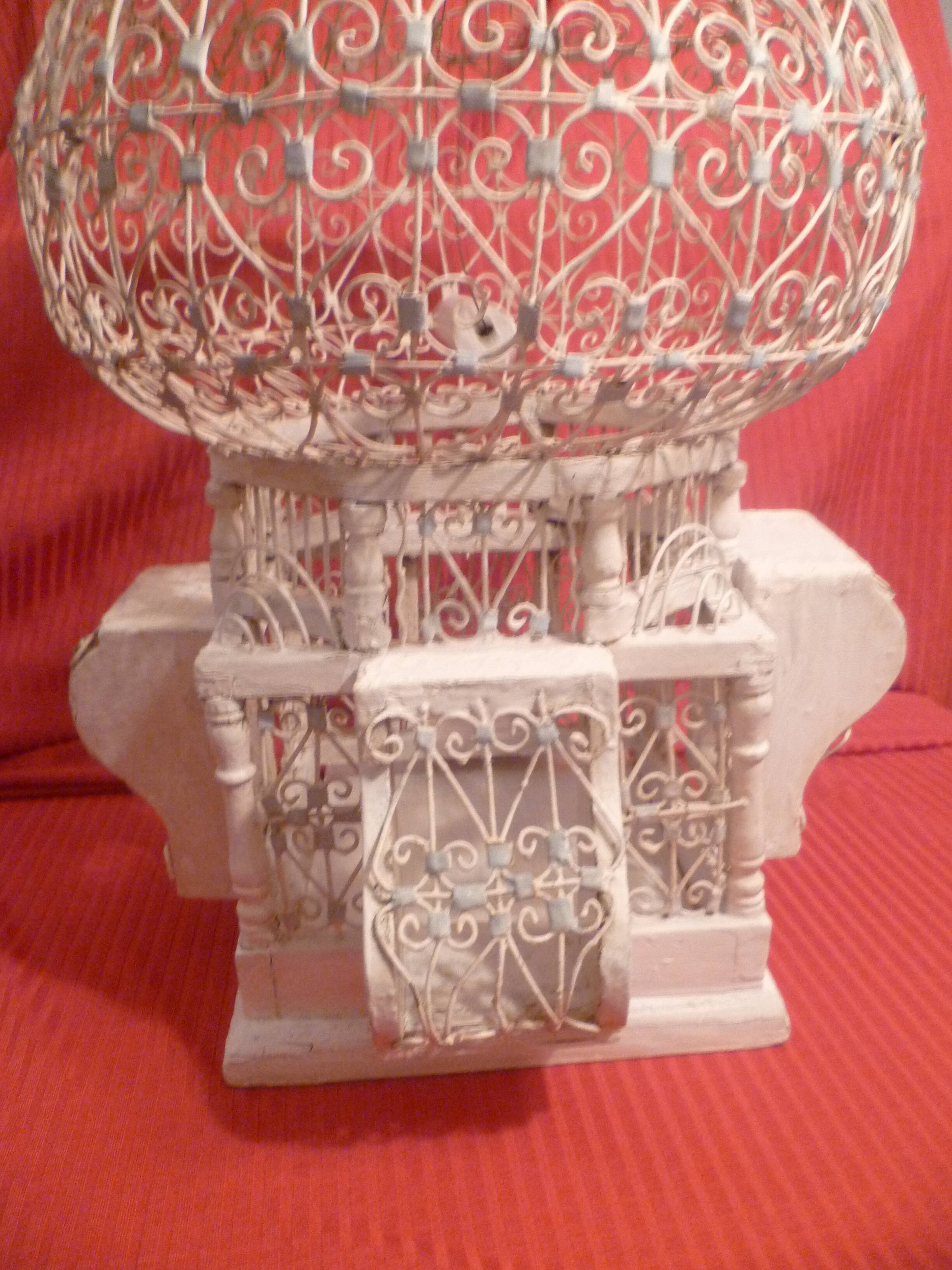 Antique handmade birdcage in metal and wood