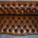 Pair of leather Chesterfield sofas by Howard & Sons