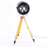 Old industrial spot on wooden tripod