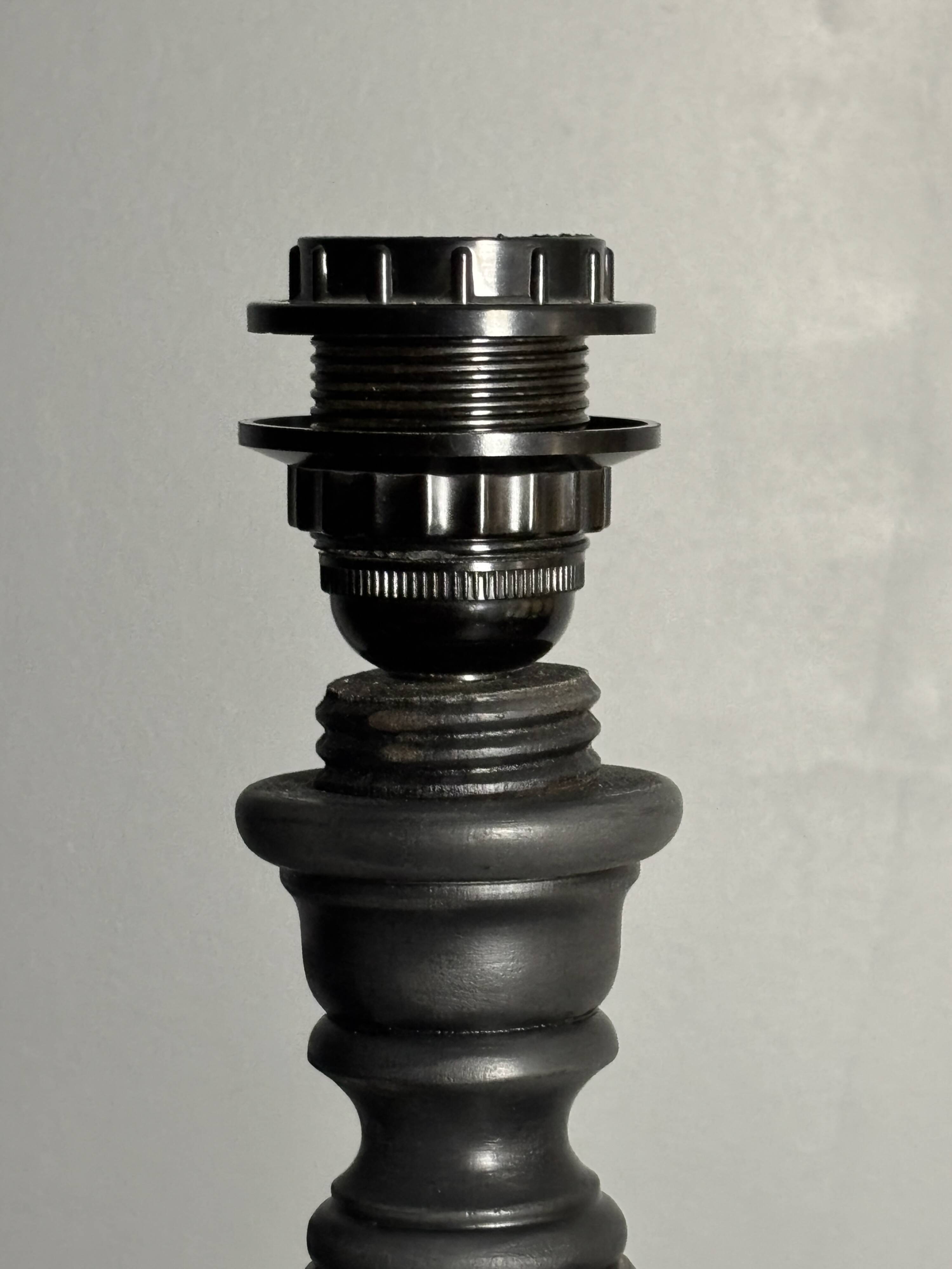 Brutalist wood turned ebonized table lamp in the style of Charles Dudouyt