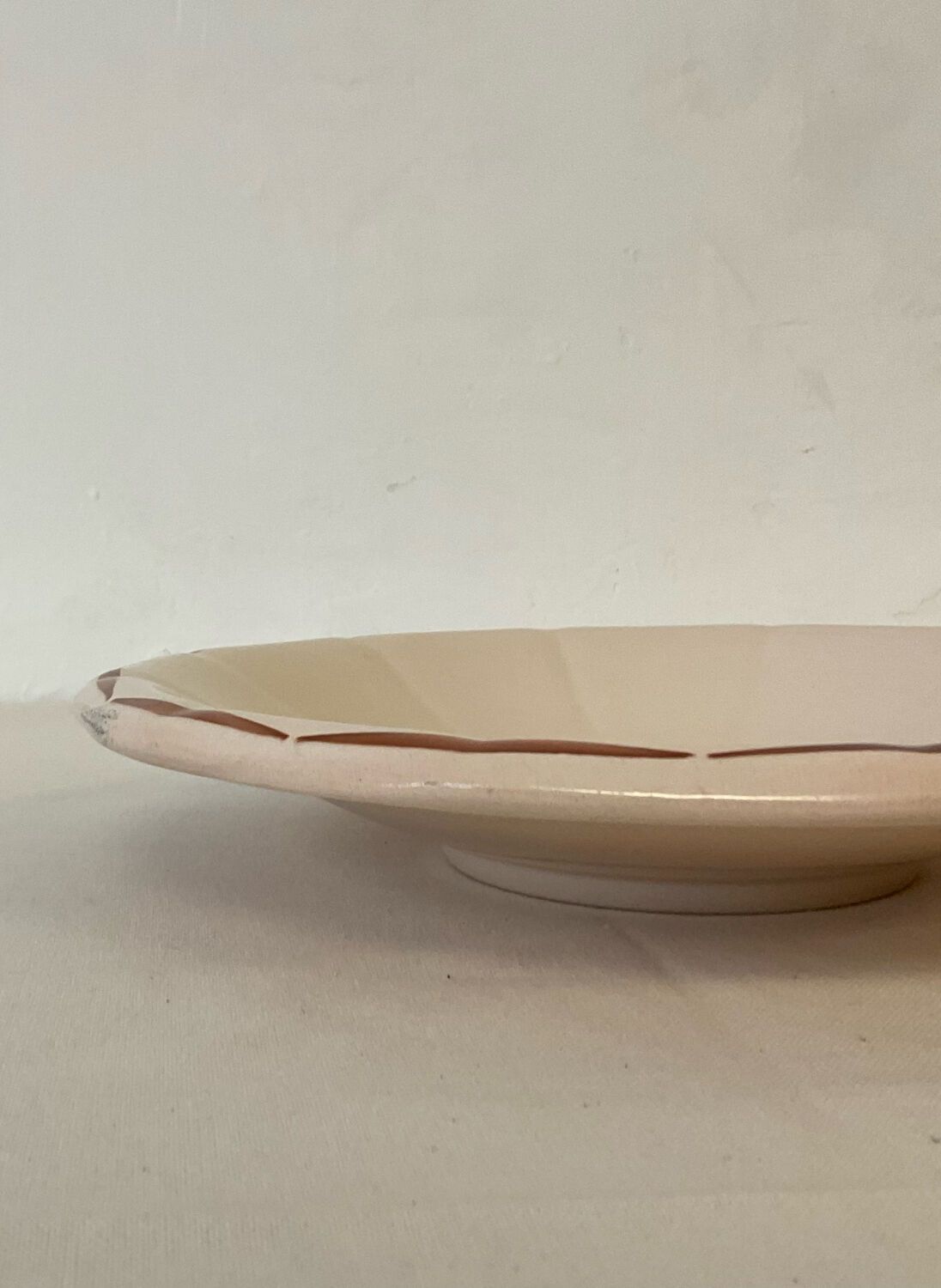 Vintage shallow dish Digoin Sarreguemines with a burgundy rose design.
