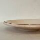 Vintage shallow dish Digoin Sarreguemines with a burgundy rose design.
