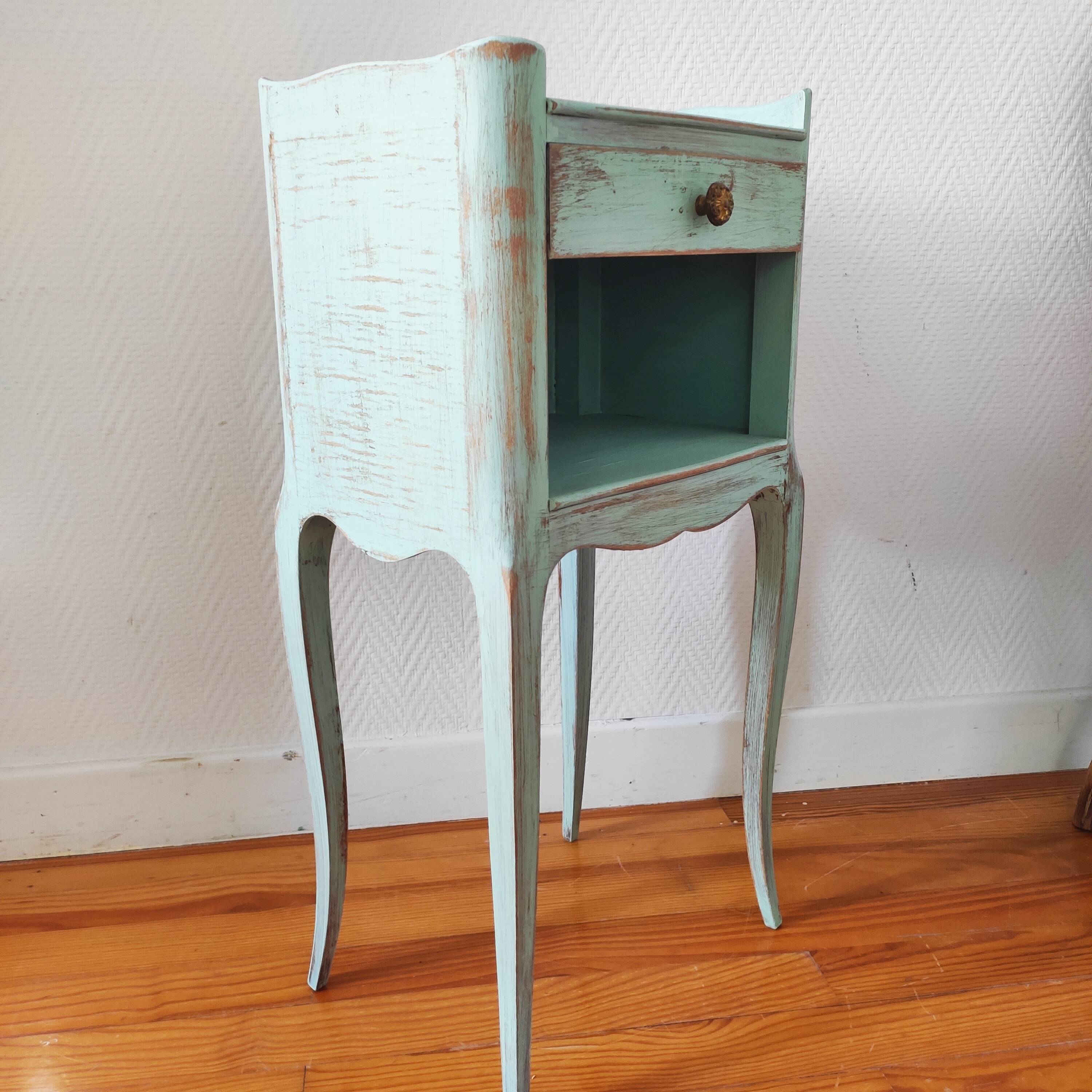 Patinated bedside table end of sofa