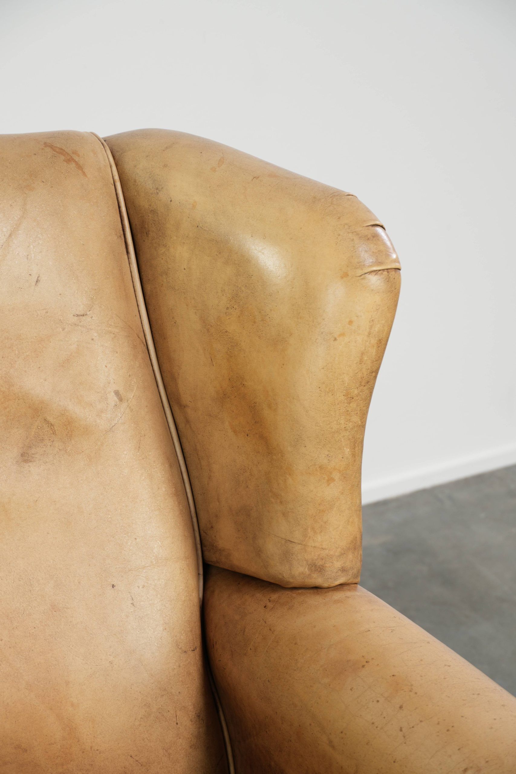 Cow leather wingback armchair with a beautiful timeless English look