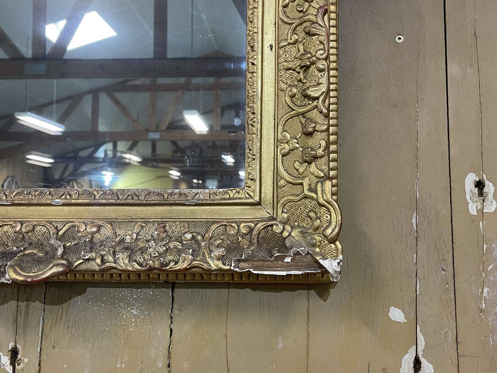 18th century Regency mirror in gilded wood