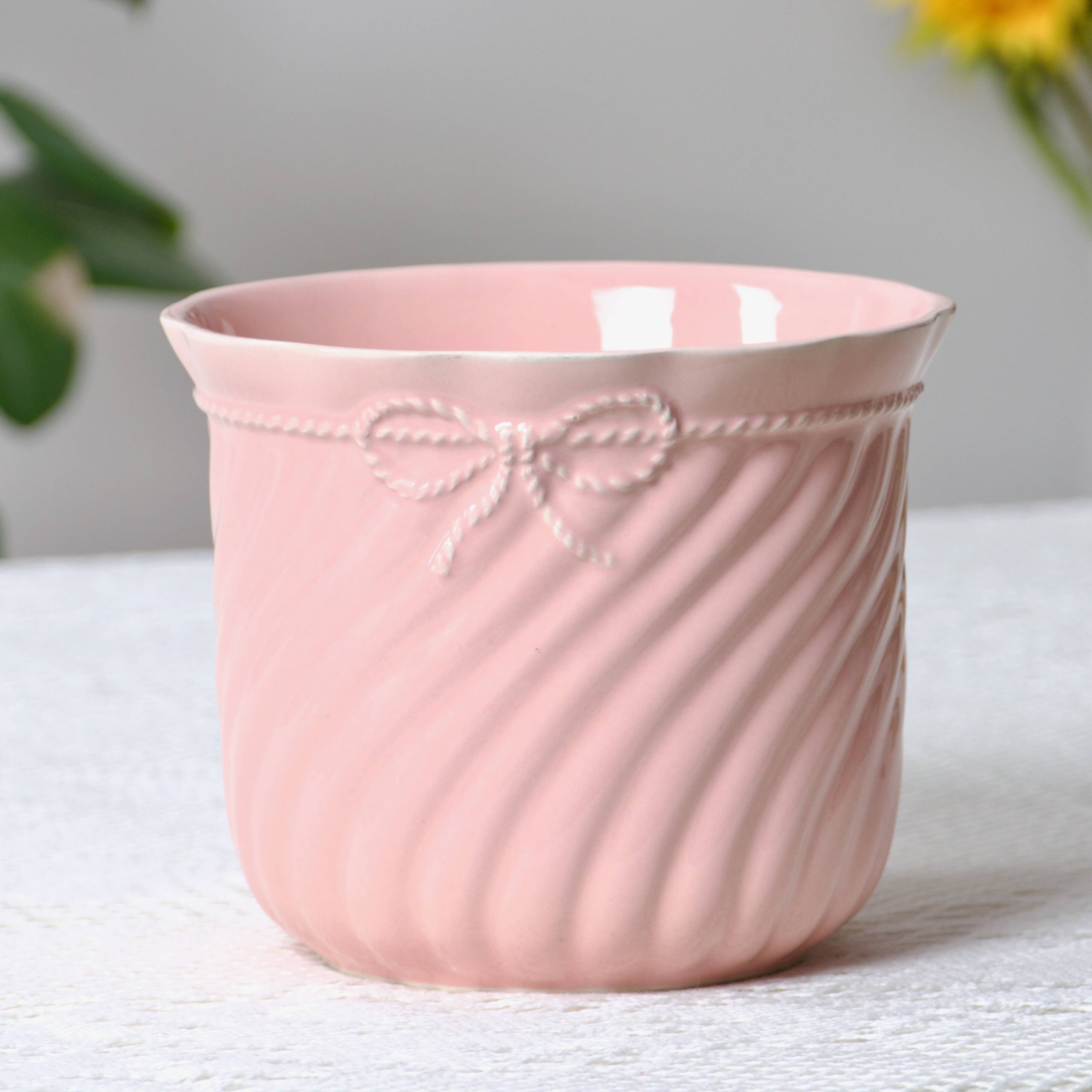 Large vintage pot holder in pink ceramic relief rope