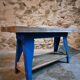 Vintage industrial workbench table with cast iron legs (Aux Forges de Vulcain)
