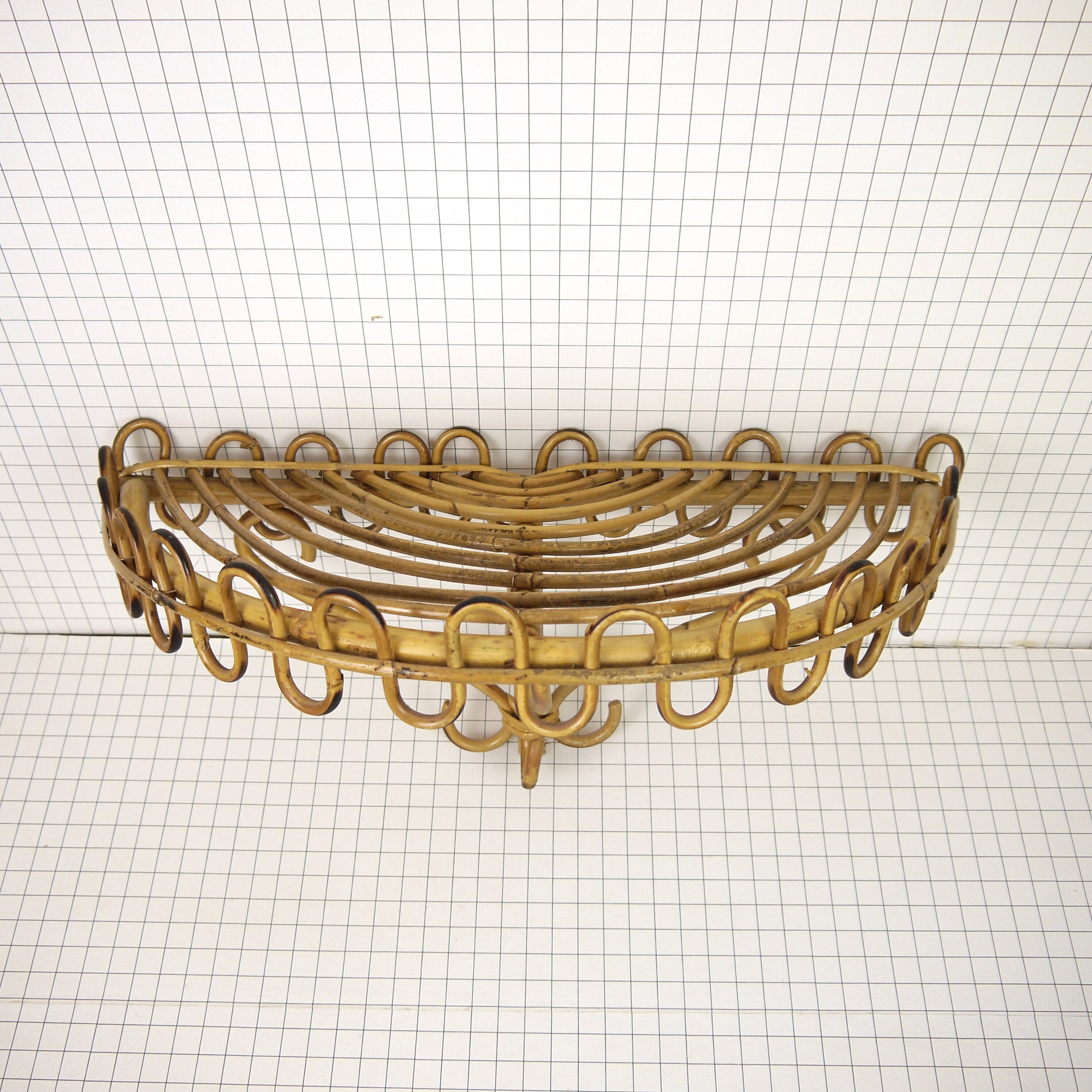 Half-moon rattan shelf and coat holder