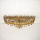 Half-moon rattan shelf and coat holder
