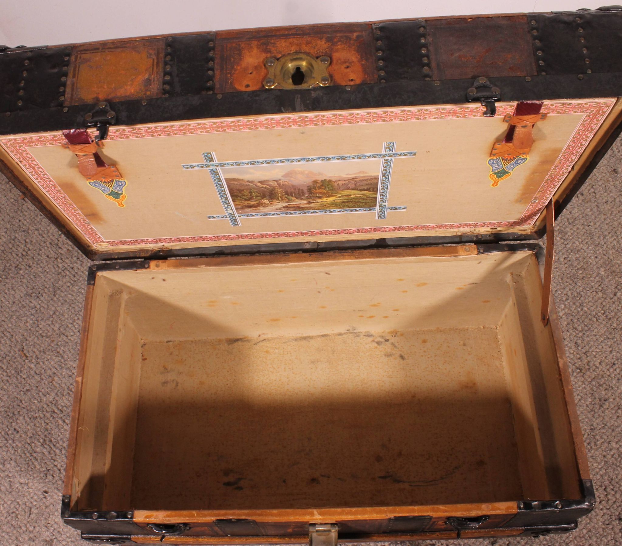 travel trunk from the early 20th century made of leather and wood