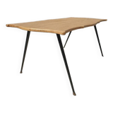 Violin-shaped coffee table with brass legs