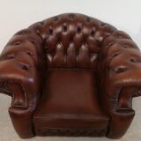 Curved brown leather chesterfield armchair