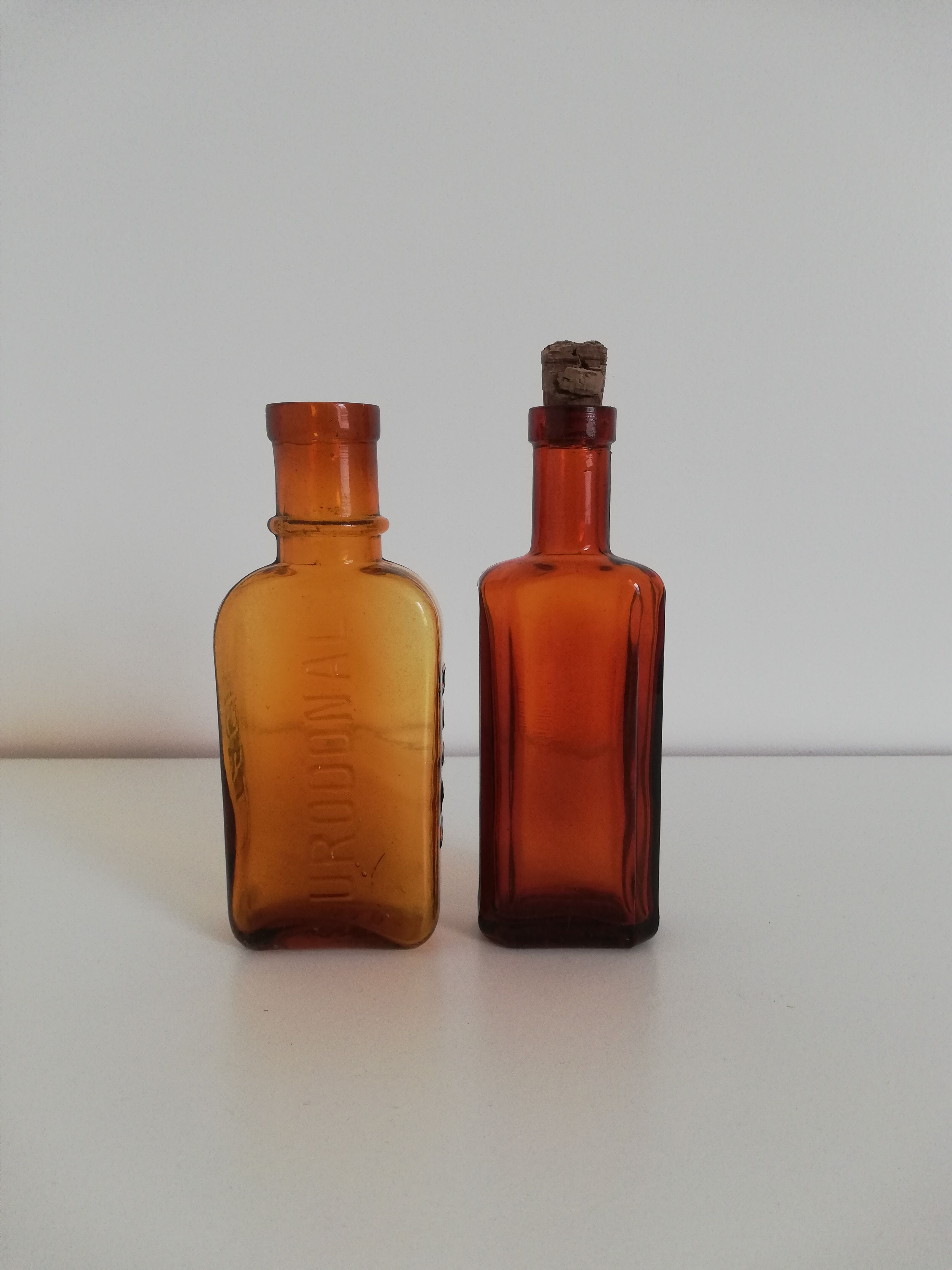 2 amber apothecary bottles