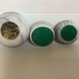 9 marble candle holders of different sizes